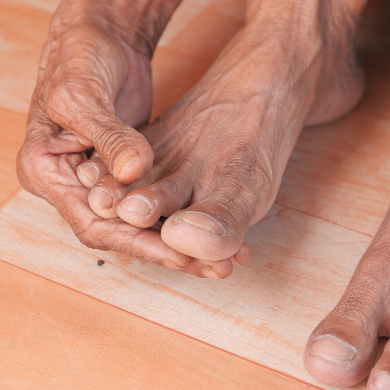 close-up-senior-women-feet-hand-massage-injury-spot